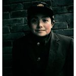 一个戴国徽帽子的男孩 彩色照片 版数10 120X96cm 2005